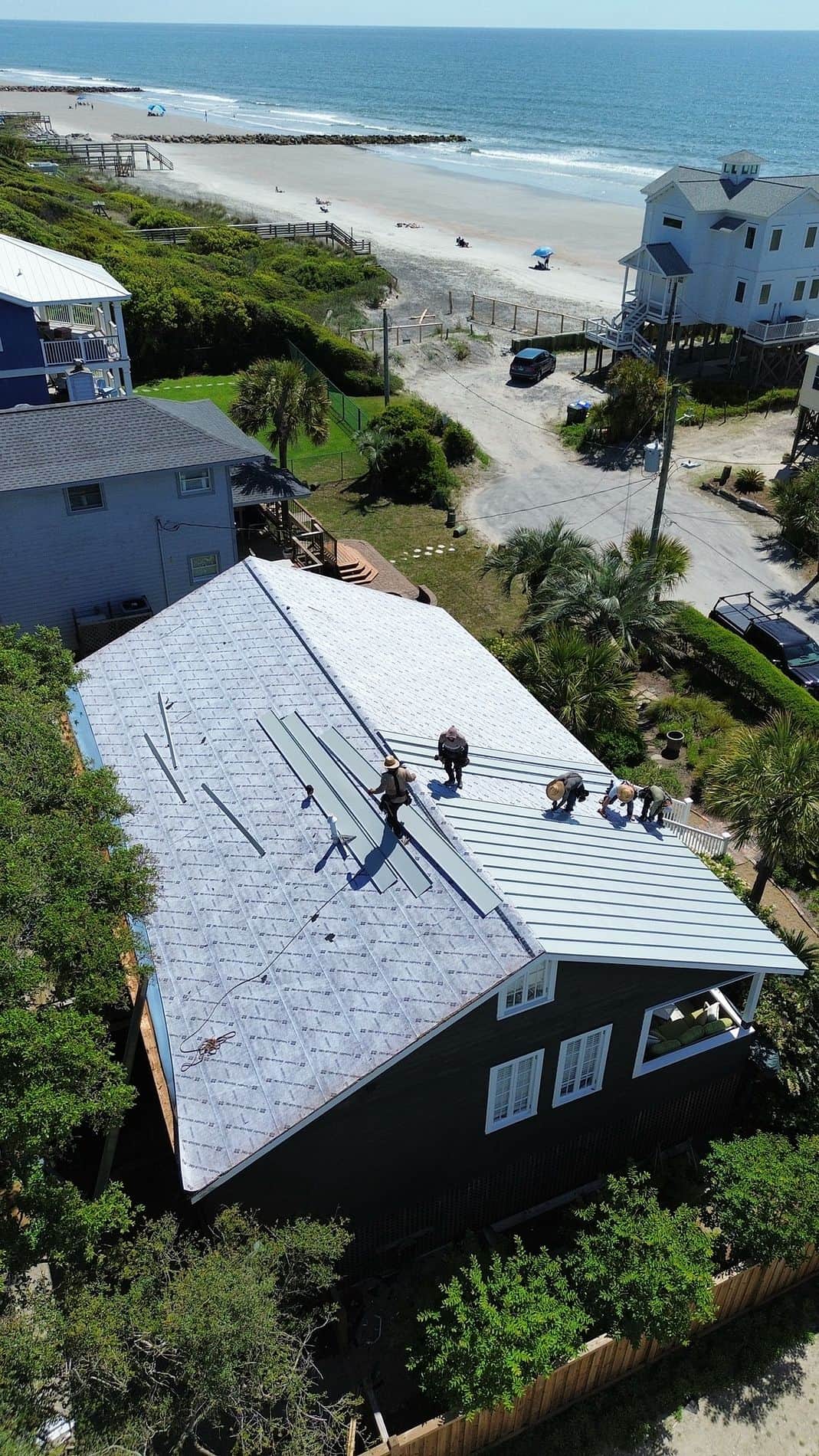 roofers on roof working